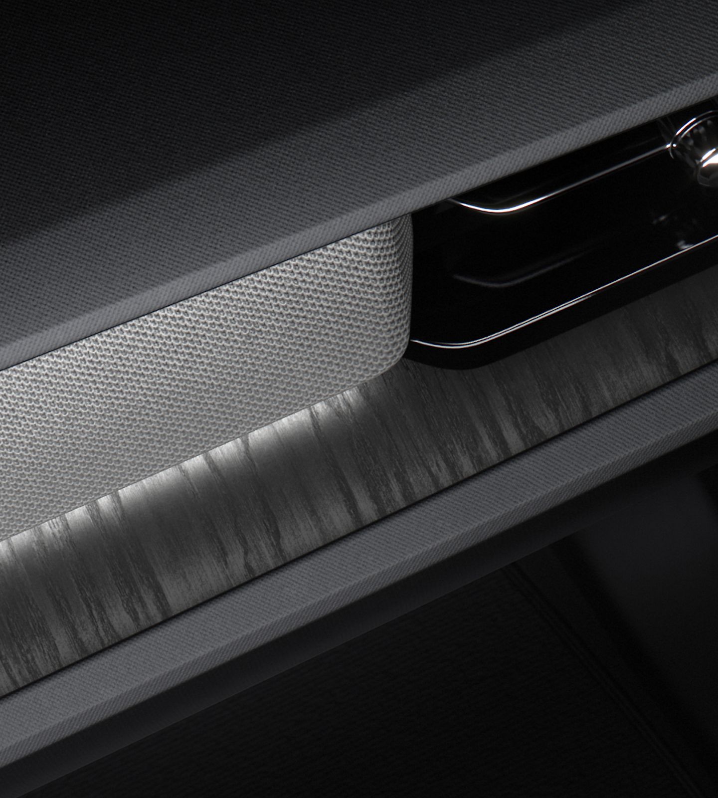 Polestar 2’s Black Ash deco illuminated with interior lighting.