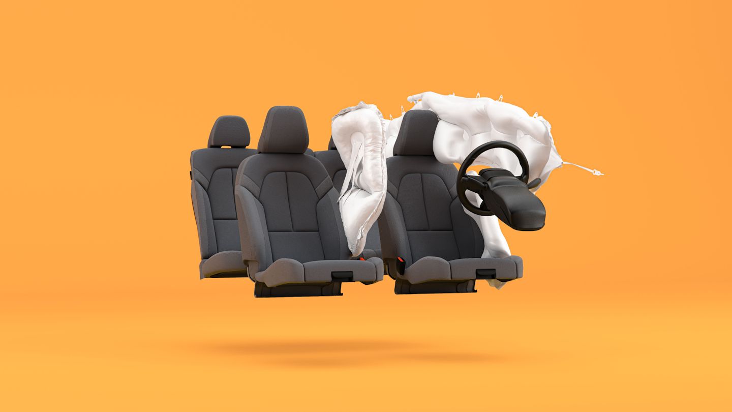 Polestar 2 seats with air bags deployed on the driver’s seat in an orange background.