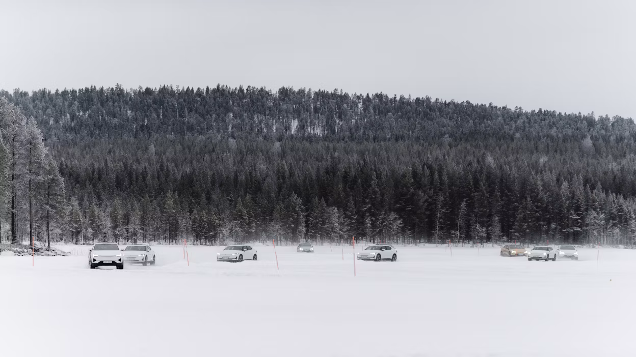 Cars race around frozen track
