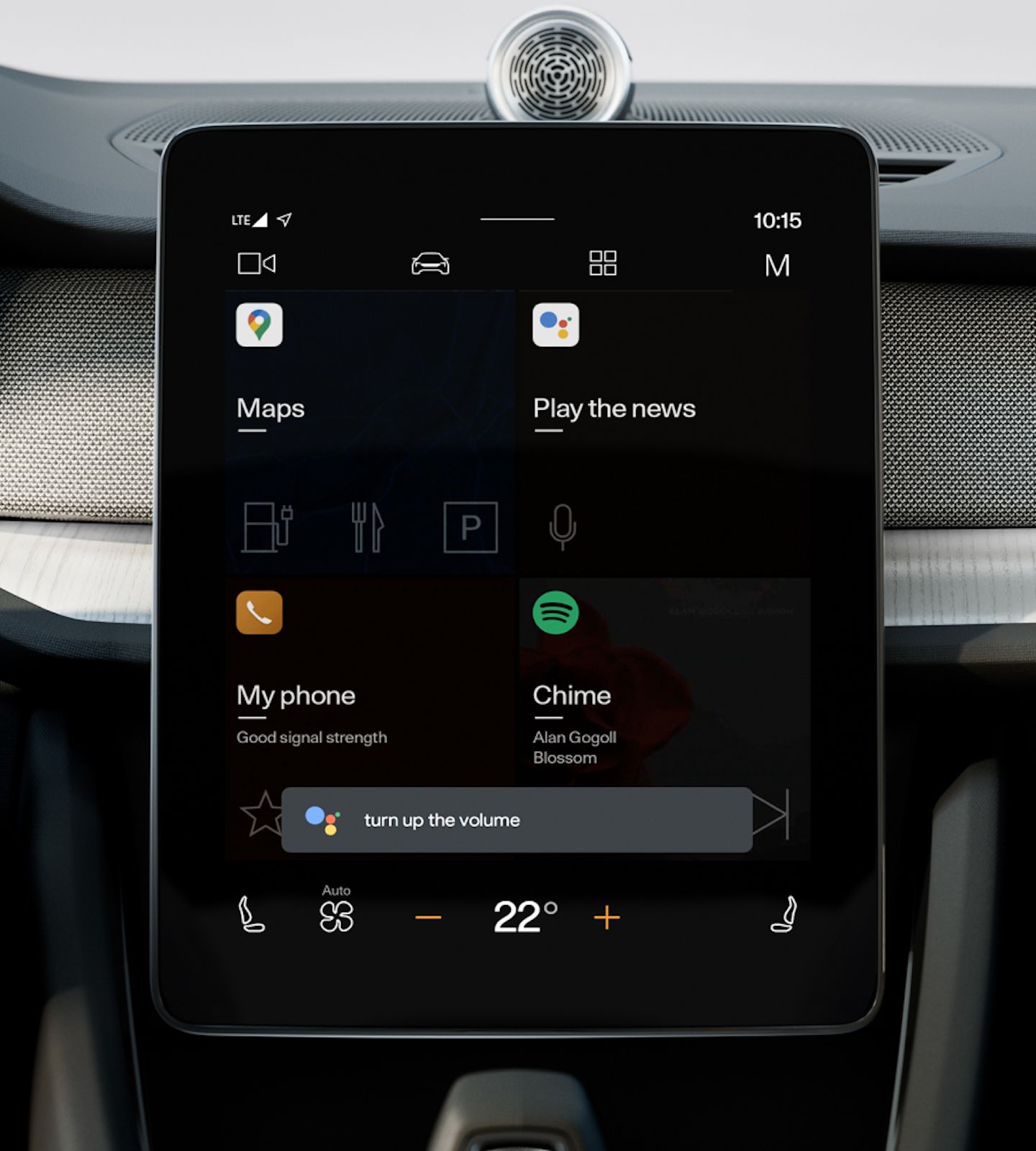 Polestar 2’s centre display showing the home screen with the Google Assistant voice prompt.