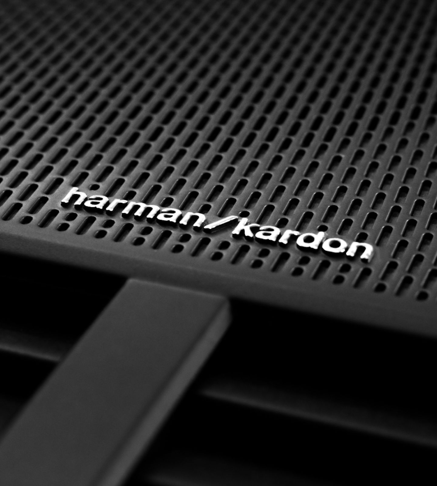 A Polestar 2 speaker with the Harman Kardon premium sound logo.