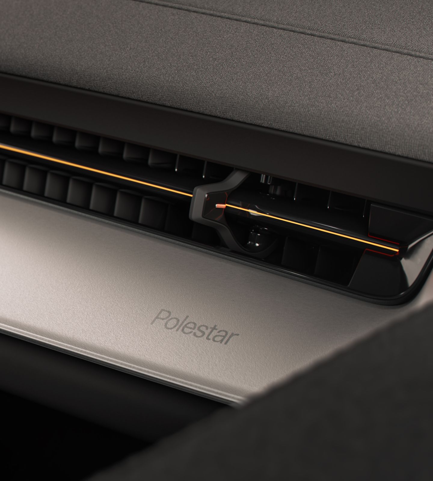 Close-up of Polestar 3’s Aluminium deco with a golden line across the ventilation.