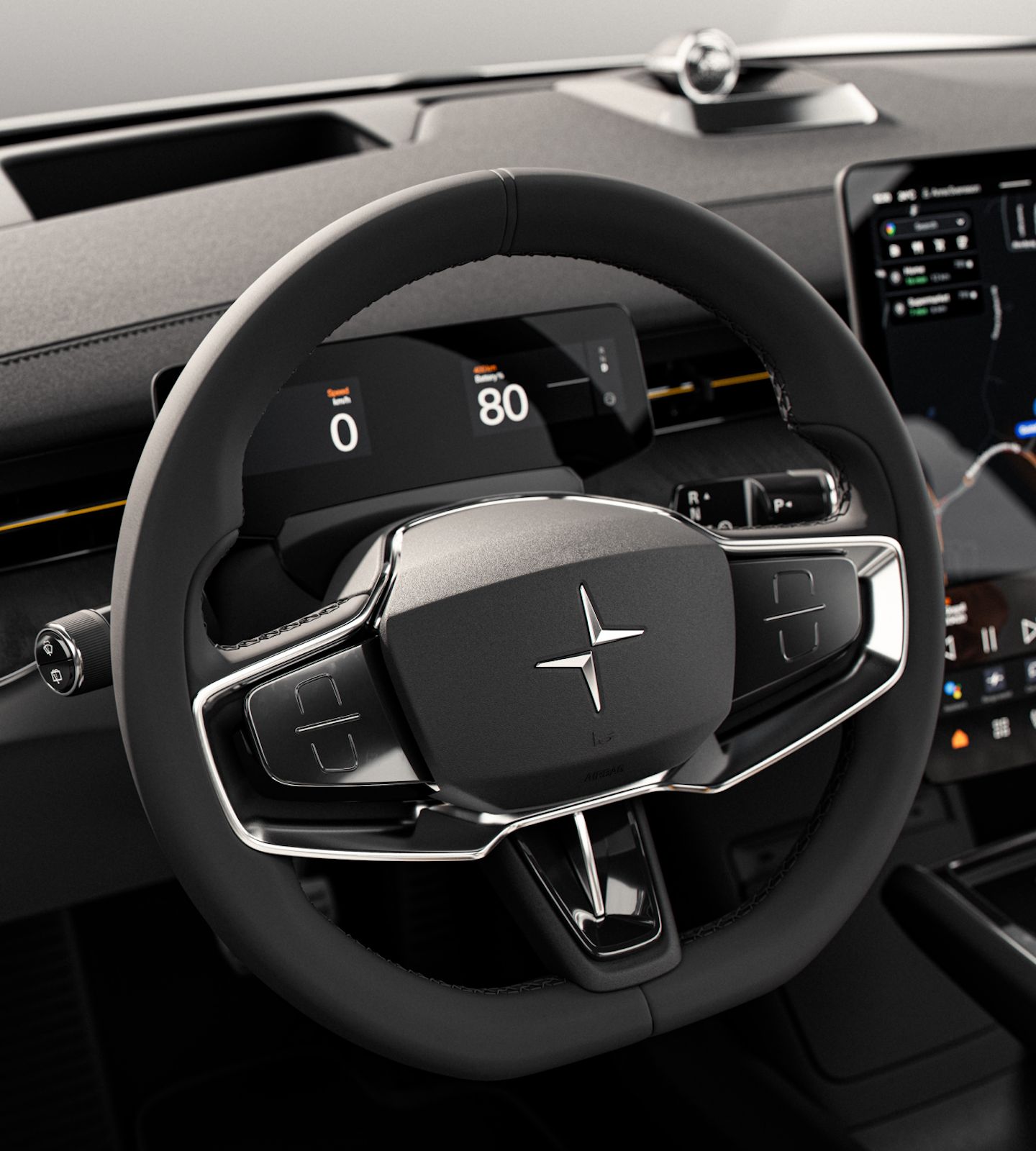 Polestar 3’s steering wheel with silver accents and Polestar logo in front of the driver display.
