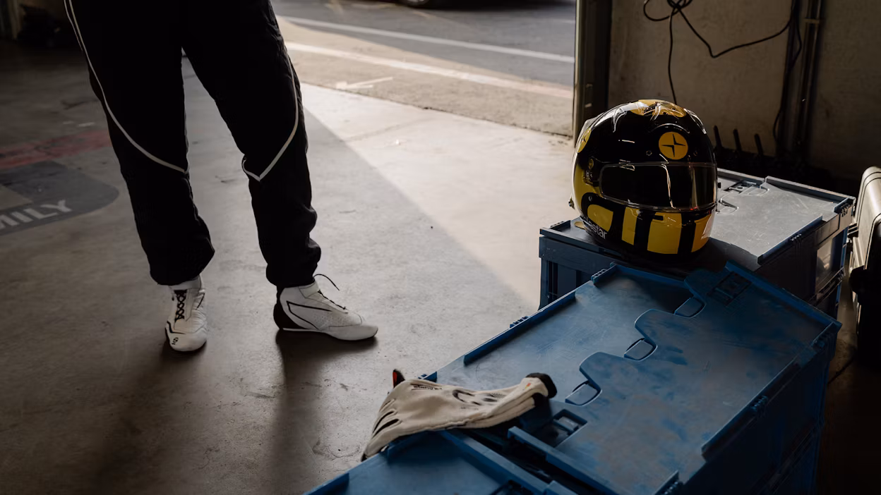 Polestar racing helmet on workshop floor