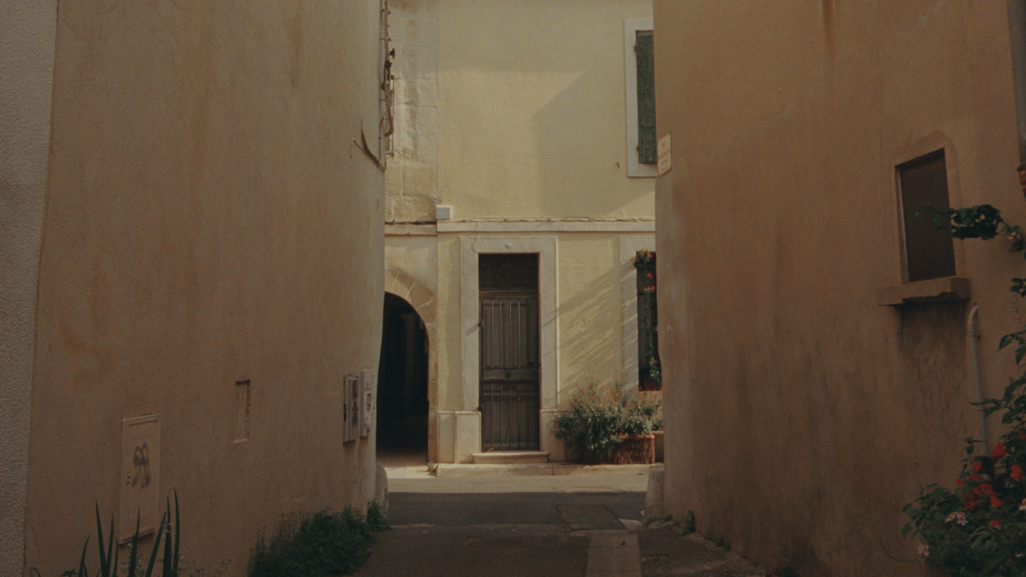Polestar 2 driven through narrow streets and on a motorway by the side of a mountain.